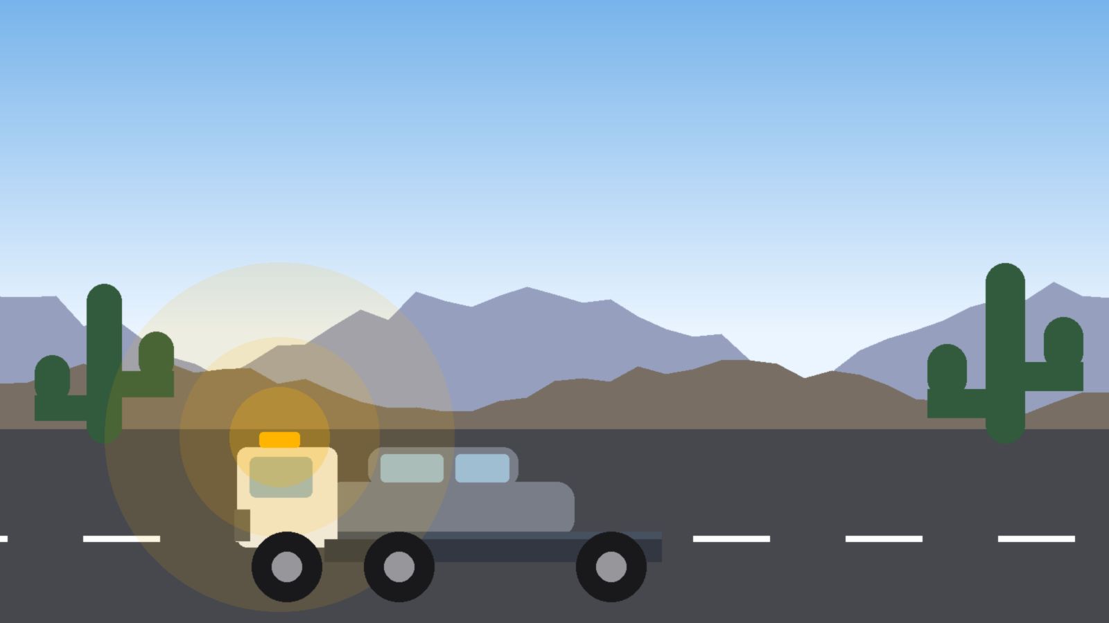 A flatbed tow truck loading a gray sedan at the side of an Arizona road